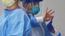 Groups that represent the state’s nursing and long-term care centers say workers need protective equipment like masks, as seen here on a medical worker in Philadelphia.