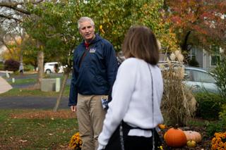 Todd Stephens (left), a Republican state representative running for reelection, speaks with supporter Linda McKillen as he goes door-to-door in his district in October. 